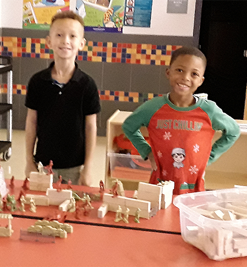 Two boys working on their diarama